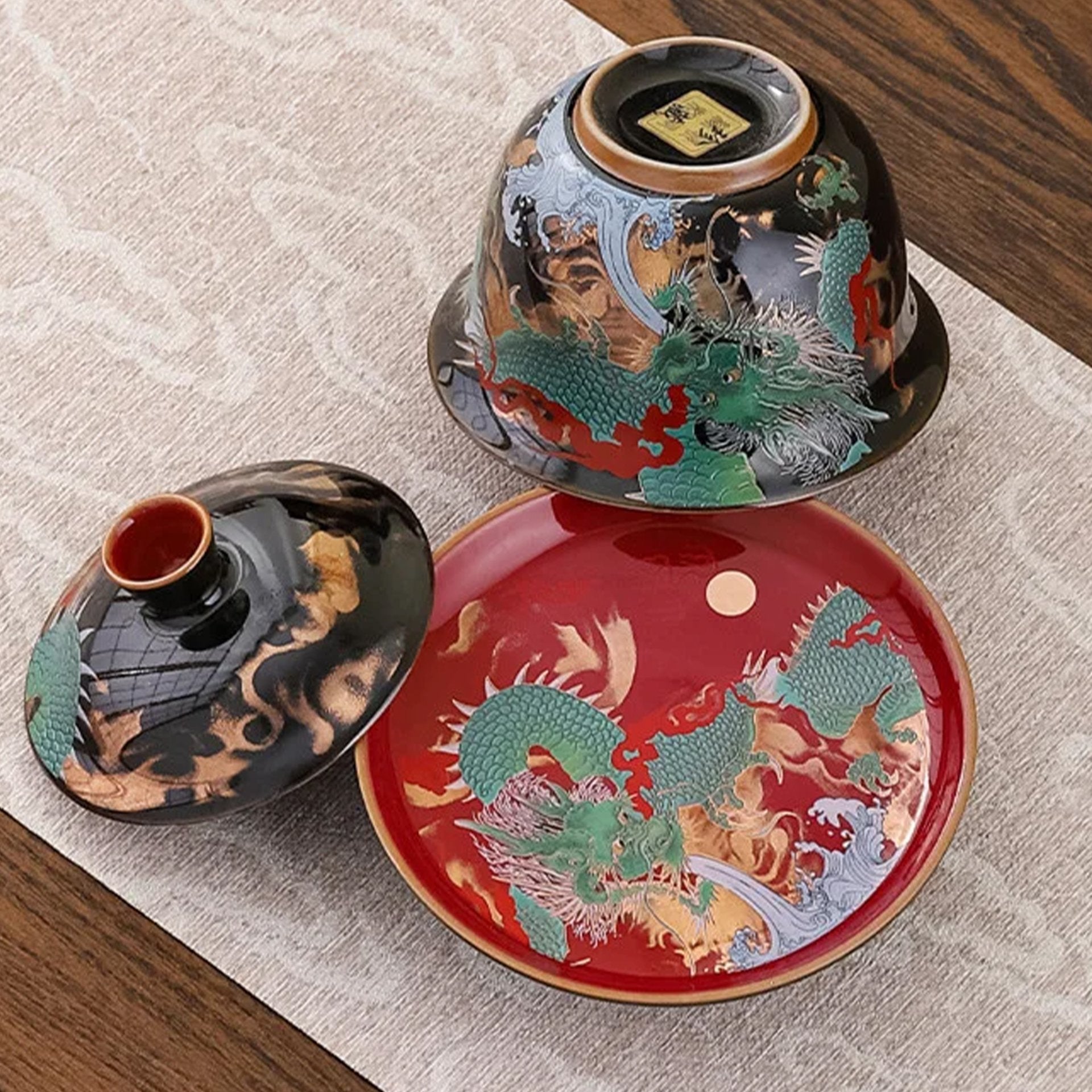 Gaiwan tea set with dragon design, viewed from above.