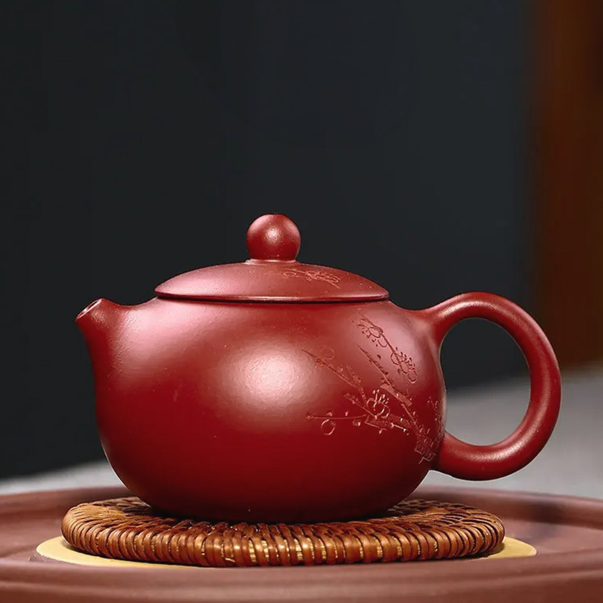 Close-up inside the red teapot showing maker's mark, detail of craftsmanship.