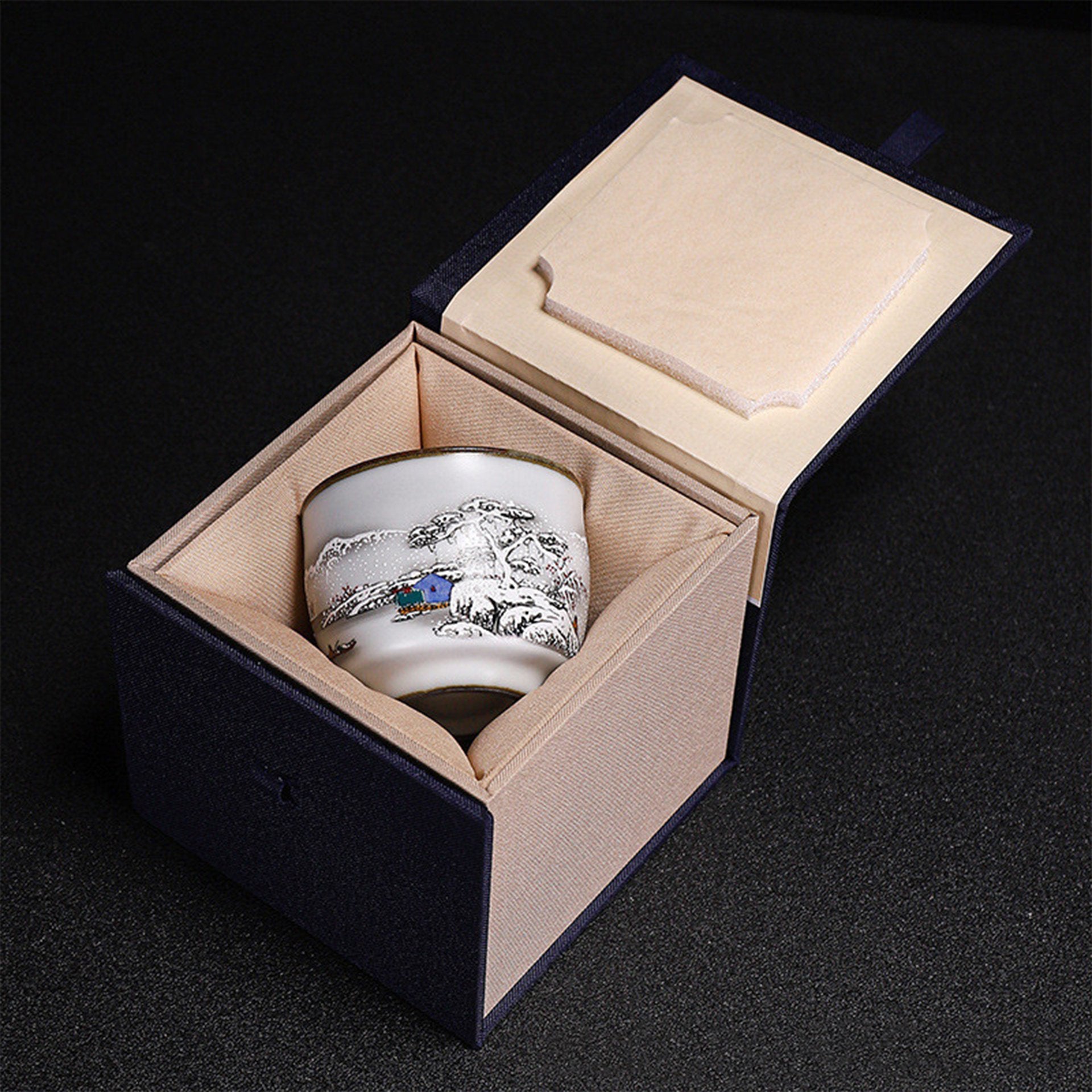 A white Japanese tea cup in a gift box