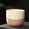 Creamy beige Japanese ceramic teacup with brown accent.