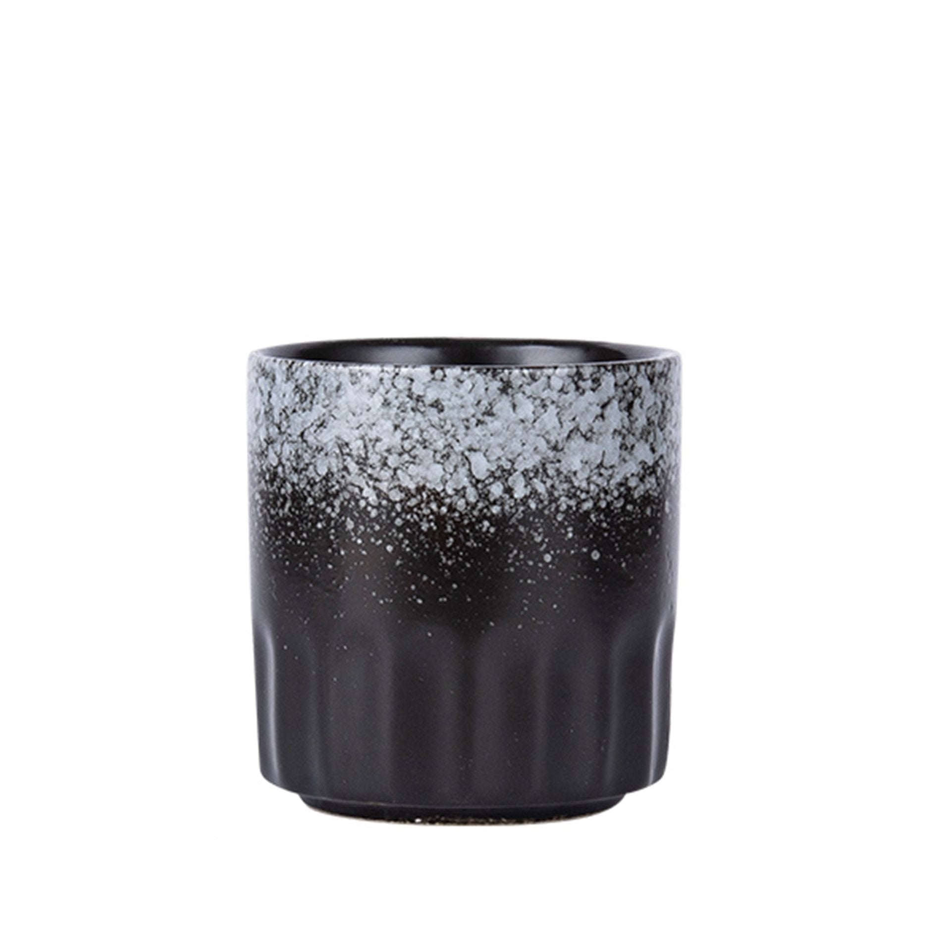 Black ceramic teacup with white frost pattern.