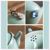 Close-up collage of teapot details: handle, blue jewel, spout, and strainer holes
