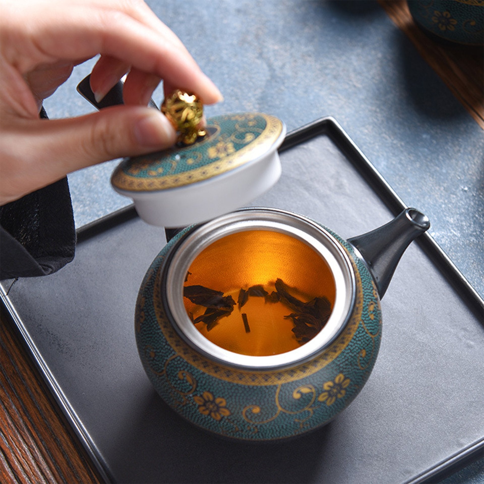 Open Yokade kyusu revealing tea leaves steeping inside